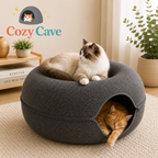 Two cats in a Cozy Cave pet bed with 'Cozy Cave' branding in the background.