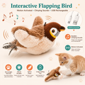 Interactive flapping bird cat toy shown on a light beige background with feature callouts, a USB charging inset, and a small orange kitten playing with the toy. Text highlights motion activation, chirping sounds, USB rechargeability, and safe plush materials.