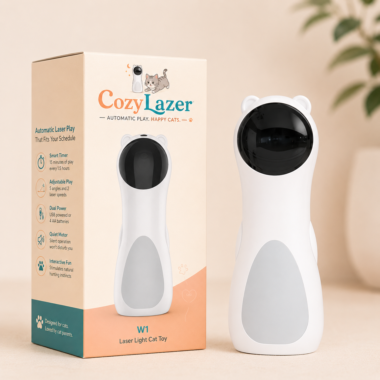 CozyLazer W1 automatic laser play happy cat toy shown next to its retail packaging box. The toy is white with a black circular laser eye on the forehead and small white bear ears on top.