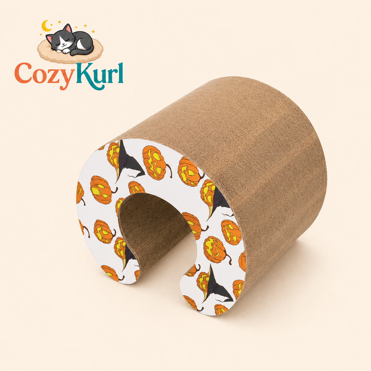 Cat-shaped pillow with pumpkin and cat pattern on a beige background, featuring Cozy Kurl brand.